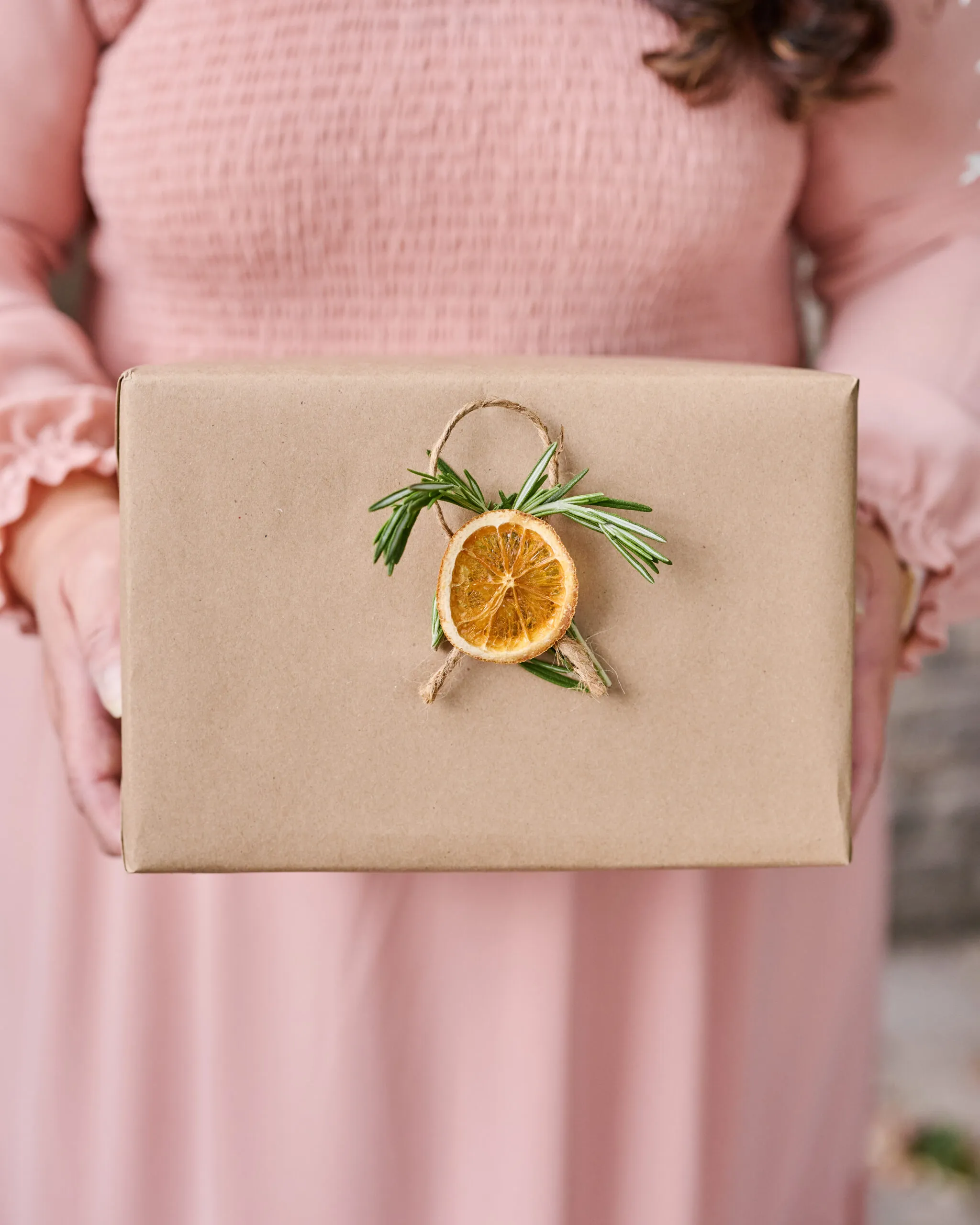 person holding a wrapped gift