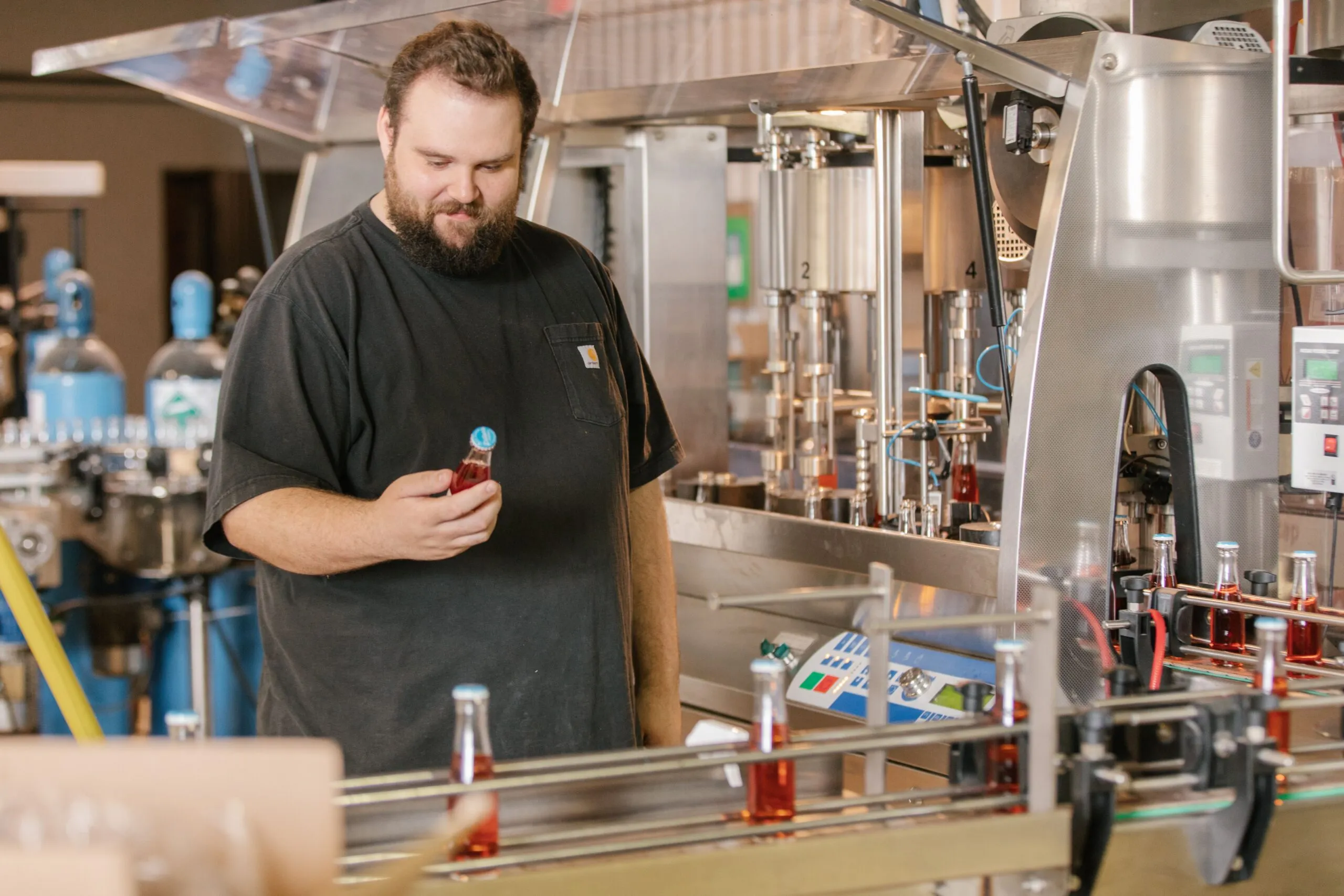 person working on the bottling line